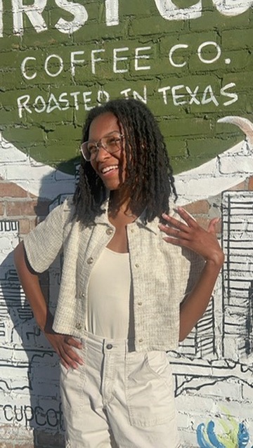 Maria Reyes in front of a coffee shop